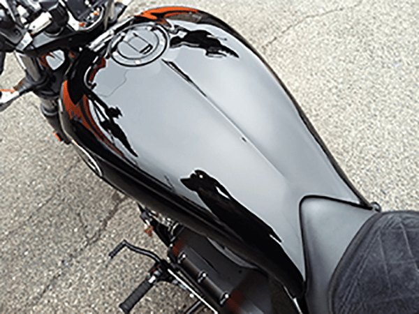 Same motorcycle tank after Hogfather detailing, deep gloss