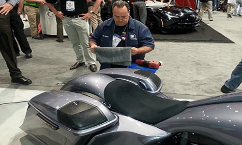 Harry demonstrating motorcycle detailing at SEMA